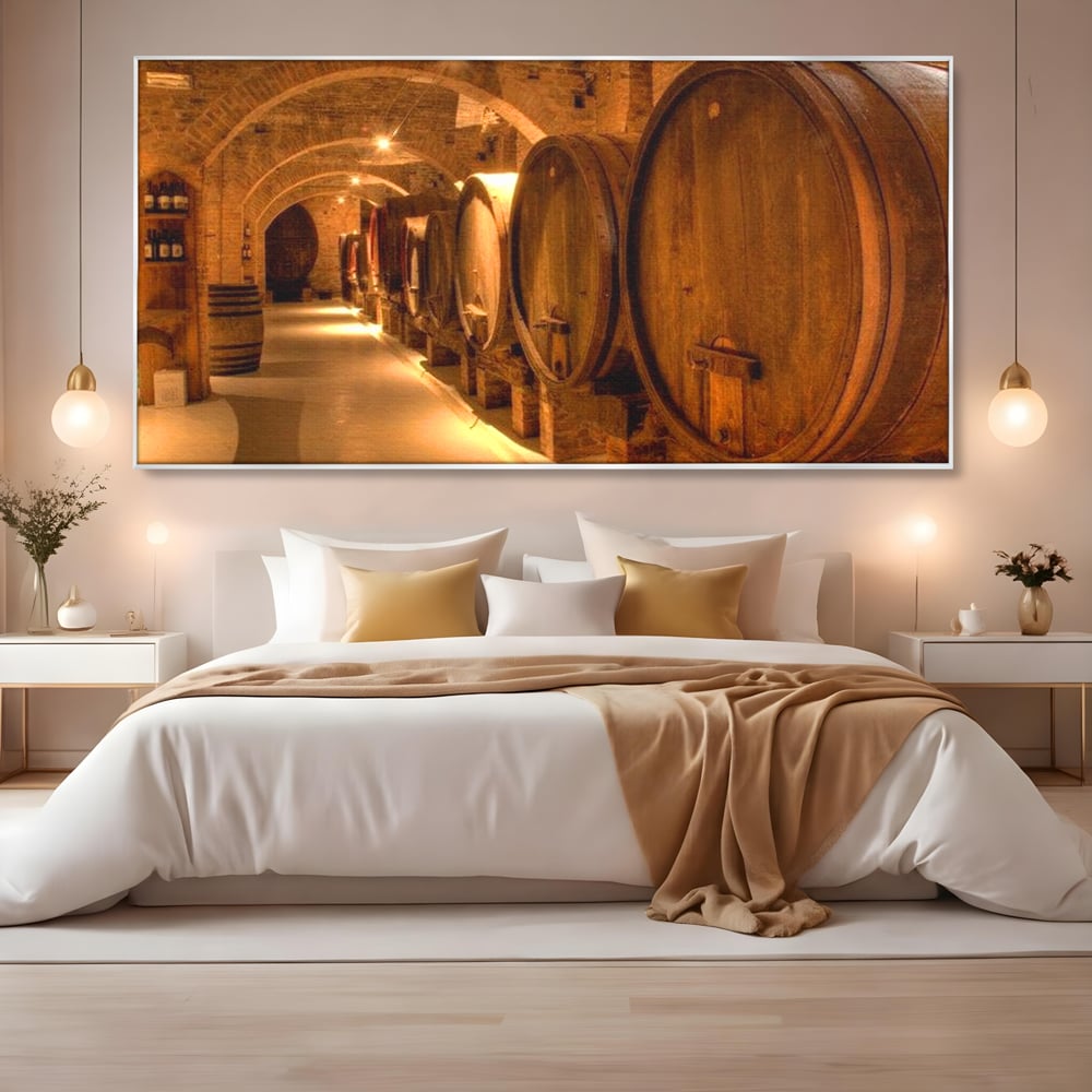 Tablou canvas cu tablou canvas cu butoaie de vin in crama, in rama de aluminiu argintiu, pe perete intr-un dormitor